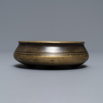 A flat Chinese bronze tripod censer, Xuande mark, 18th C.