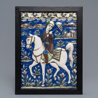 Un carreau rectangulaire à décor d'un prince sur cheval, art qajar, Iran, 19ème