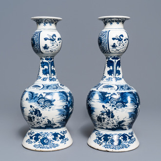 A pair of tall Dutch Delft blue and white chinoiserie vases, early 18th C.