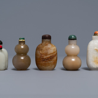 Five Chinese celadon and russet jade snuff bottles, 19/20th C.