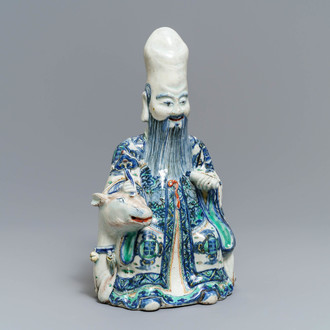 A rare Chinese wucai figure of Shoulao seated on a deer, Wanli