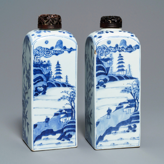 A pair of Chinese blue and white square tea caddies with landscapes and flowers, Kangxi