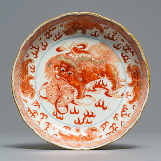 A Chinese blue, white and iron red 'Buddhist lion' plate, Qianlong mark, 18/19th C.