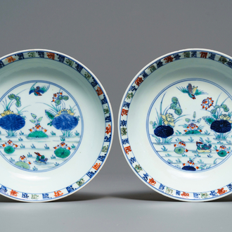 A pair of Chinese doucai 'ducks and lotus pond' plates, Chenghua mark, 18th C.