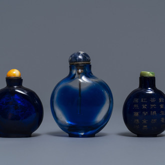 Three Chinese transparent blue glass snuff bottles, one inscribed, 18/19th C.