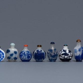 Nine various Chinese blue overlay glass snuff bottles, 19/20th C.