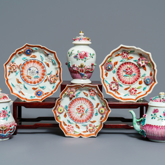 A Chinese famille rose relief-decorated teapot, milk jug and tea caddy on stands, Yongzheng