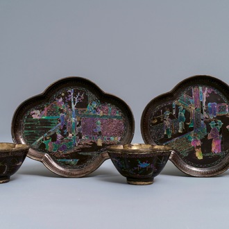 A pair of Chinese silver and lac burgauté quatrefoil cups and saucers, Kangxi
