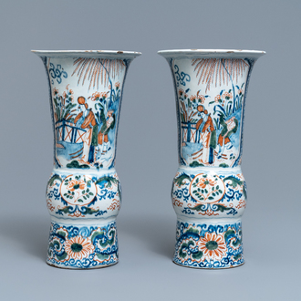 A pair of polychrome Dutch Delft chinoiserie beaker vases, 18th C.