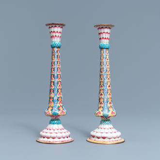 A pair of Chinese Canton enamel candlesticks with floral design, Yongzheng