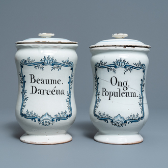 A pair of blue and white French faience albarello-type drug jars and covers, 2nd half 18th C.