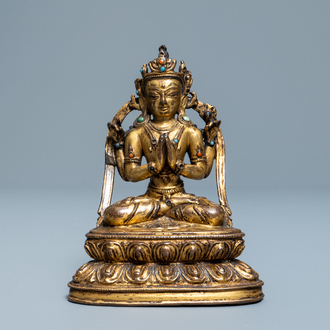 Une figure de Bouddha en bronze doré incrusté, Sino-Tibet, Ming