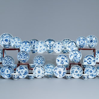 A collection of 22 Chinese blue and white cups and 32 saucers, Kangxi/Qianlong