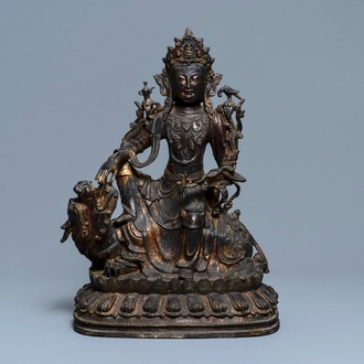 A large Chinese bronze group of Guanyin on a dragon, prob. Ming