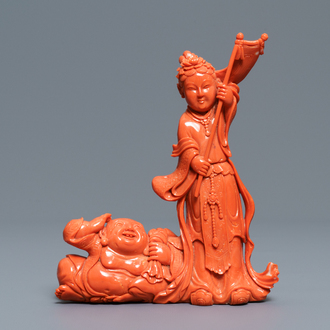 A Chinese carved coral group with a laughing Buddha, Republic, 20th C.