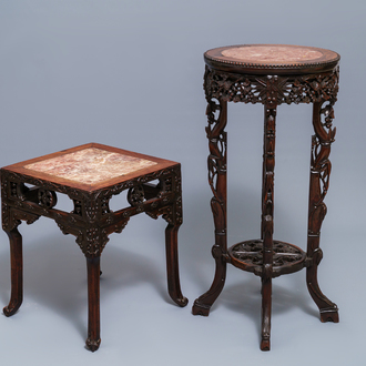 Two Chinese carved wooden stands with marble tops, 19/20th C.