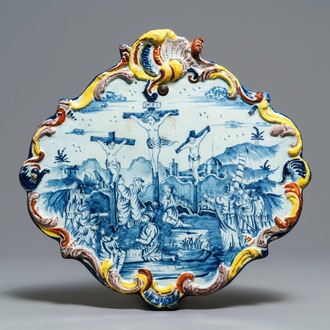 A polychrome Dutch Delft 'Crucifixion' plaque, 18th C.