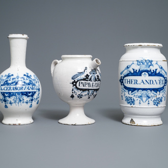 A large Dutch Delft blue and white albarello, a wet drug jar and a Brussels faience bottle, 18th C.