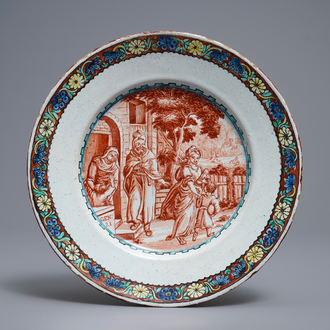 Une assiette en faïence polychrome de Delft petit feu à décor religieux, 18ème