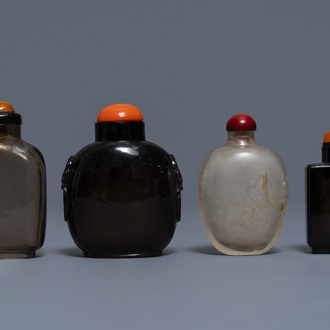 Four Chinese smoky quartz and simulating glass snuff bottles, 18/19th C.
