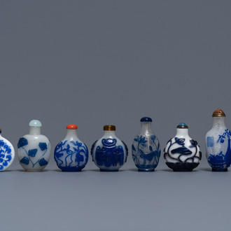 Nine various Chinese blue overlay and transparent glass snuff bottles, 19/20th C.