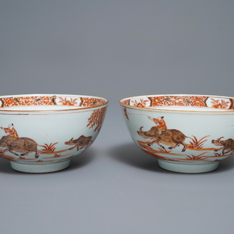 A pair of Chinese iron red bowls with a kiting boy on an ox, Yongzheng