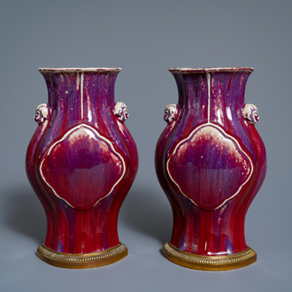 A pair of Chinese flambé-glazed vases on gilt bronze stands, 18/19th C.