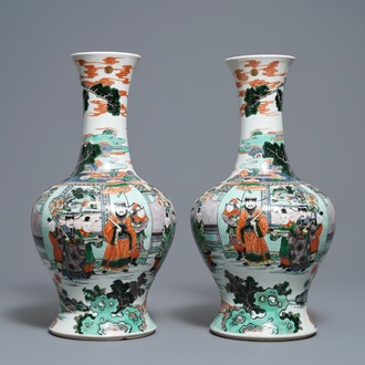 A pair of Chinese famille verte vases with figures on a terrace, Kangxi mark, 19th C.