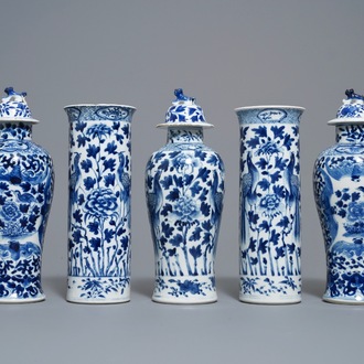 A Chinese blue and white five-piece garniture with peacocks, Kangxi mark, 19th C.