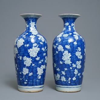 A pair of Chinese blue and white 'prunus on cracked ice' vases, 19th C.