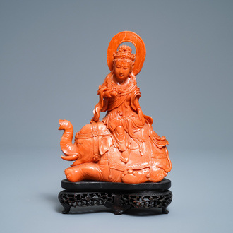 A Chinese carved red coral group of Guanyin on an elephant, 19th C.