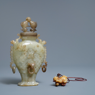 A Chinese jade 'twin fish' vase and a russet jade model of a dog, 19/20th C.