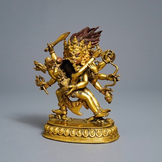 A Sino-Tibetan gilt bronze group of Mahakala and his consort Yab-Yum, 19th C.