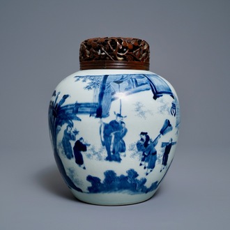 A Chinese blue and white ginger jar with figures in a landscape and a wooden cover, Transitional period