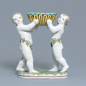 A polychrome faience group with two Bacchus figures, Geo Martel, Dèsvres, early 20th C.