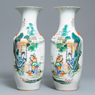 A pair of Chinese famille rose vases with figures in a garden, 19/20th C.