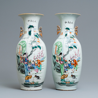 A pair of Chinese famille rose vases with ladies and boys in a garden, 19/20th C.