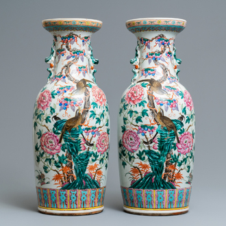 A pair of Chinese famille rose vases with birds among blossoms, 19th C.