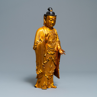 A Chinese gilt and laquered wooden figure of Buddha, 18/19th C.