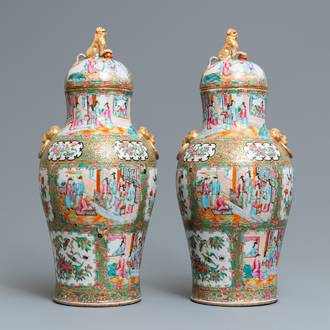 A pair of Chinese Canton famille rose vases and covers, 19th C.