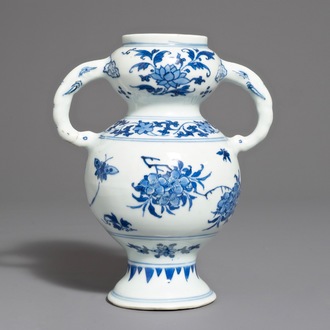 A Chinese blue and white vase with floral design, Transitional period