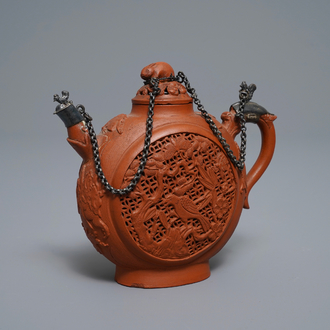 Een Chinese dubbelwandige opengewerkte Yixing steengoed theepot met zilveren montuur, Kangxi