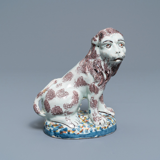 A polychrome Brussels or Lille faience model of a lion, late 18th C.