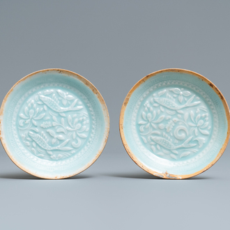 A pair of Chinese qingbai moulded saucer dishes, Song