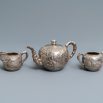 A Chinese silver teapot, cream jug and sugar jar, marked Luen Wo - Shanghai, late 19th C.