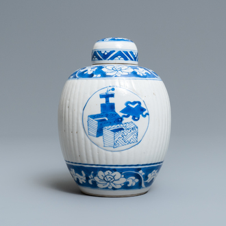 A Chinese ribbed blue and white jar and cover, Kangxi