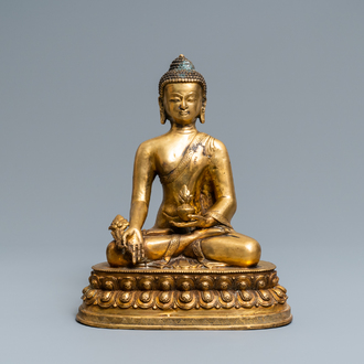 A Tibetan gilt bronze figure of Buddha, early 20th C.