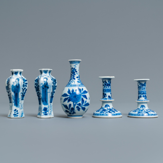 A pair of small Chinese blue and white candlesticks and three vases, Kangxi