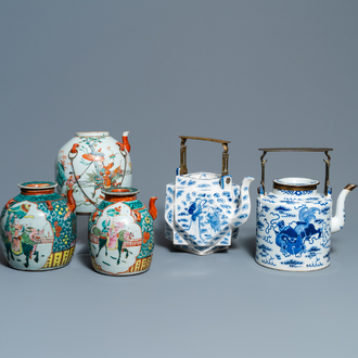 Two large Chinese blue and white and three famille rose teapots, 19/20th C.