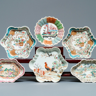 Three Chinese famille rose teapot stands, two spoon trays and a saucer, Yongzheng/Qianlong